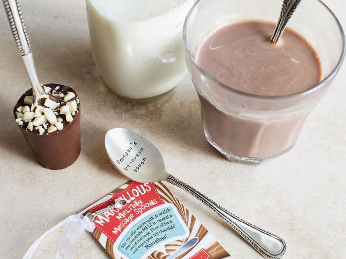 A sweet treat on a spoon that reveals a surprise message when the chocolate melts