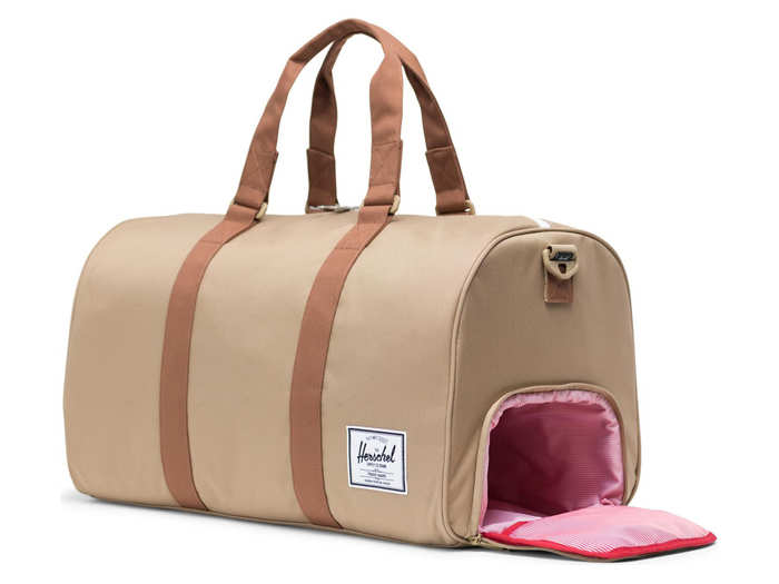 A duffle bag with a separate compartment for shoes