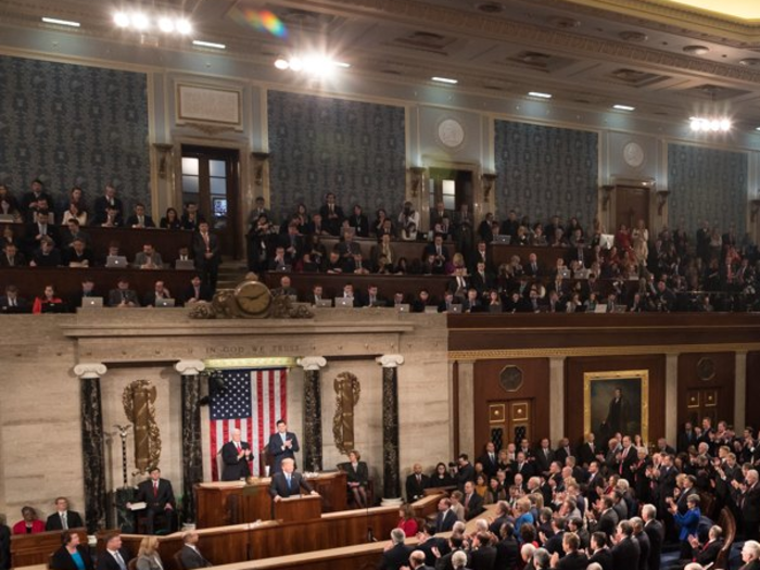 The Capitol press corps sit directly above and behind the president.