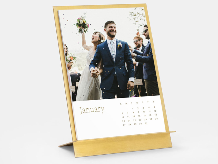 A calendar with photos of the happy couple