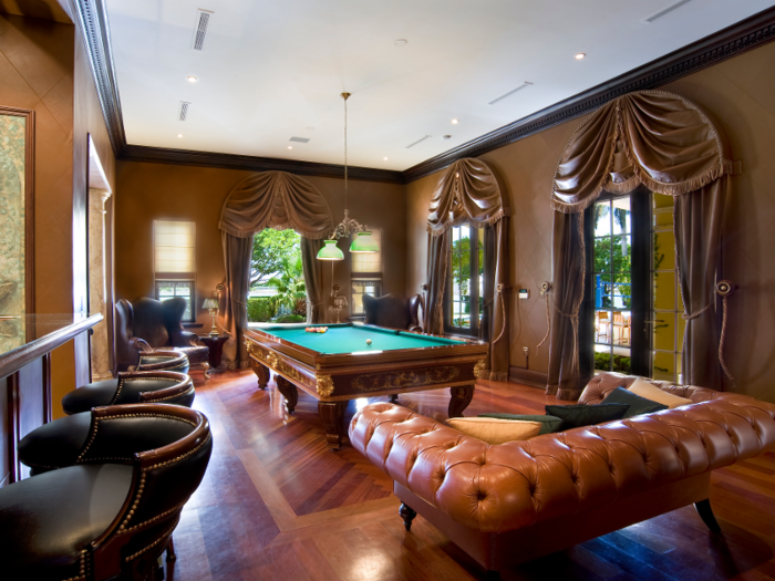 The home also has a billiards room, complete with leather furniture ...