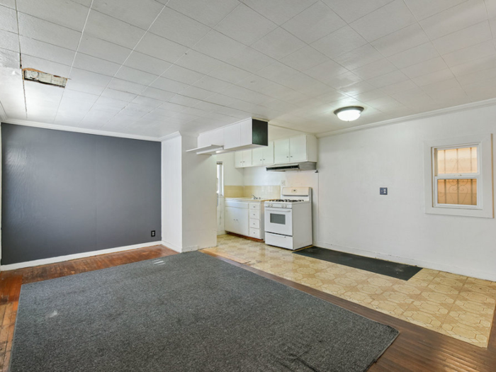 A grey wall accents the living room.