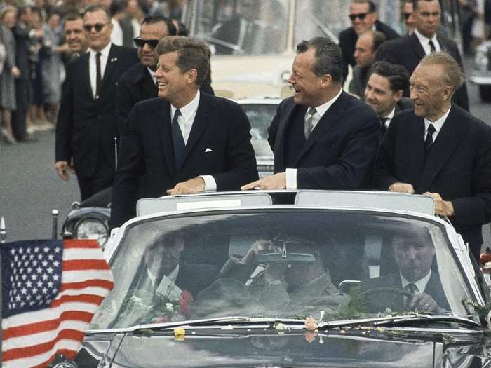 The press followed the president abroad to West Berlin, Germany in 1963, where Kennedy toured the city with Mayor Willy Brandt.