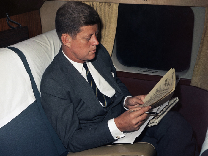 President-elect Kennedy began celebrating his election victory before he traveled from New York City to Washington, DC to be sworn in. On the way, he was photographed reviewing a draft of his inauguration speech.