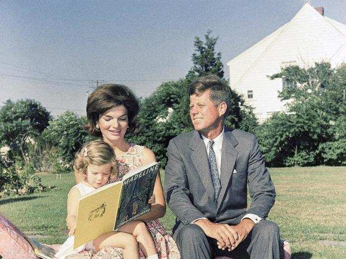 The senator and his young family were often at the Kennedy Compound in Hyannisport, pictured here in July 1960 with three-year-old daughter Caroline.