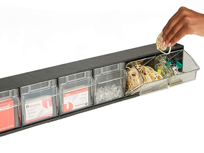 A storage bin with tip-out drawers