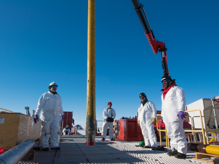 After the deep hole was drilled into the ice, the team used a gravity corer — essentially a tube that gets screwed into the ice — from the Woods Hole Oceanographic Institute to pull samples of ice and mud back to the surface.