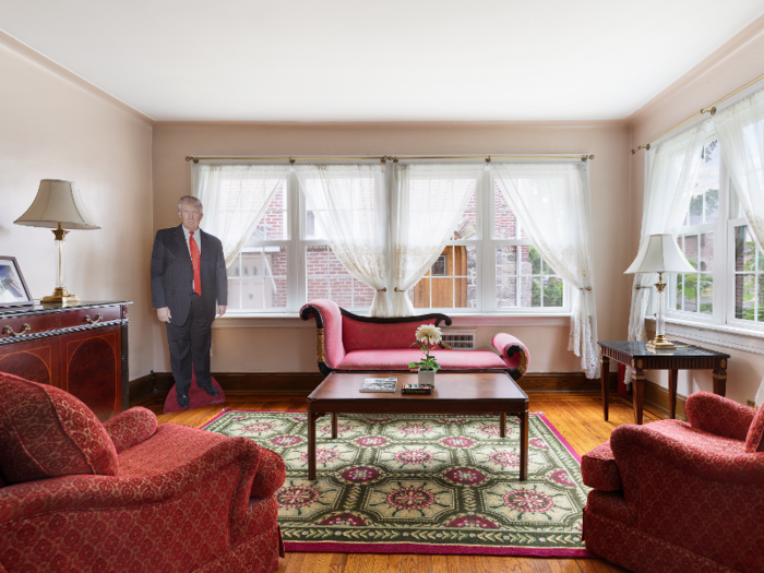 A life-sized cardboard cutout of Trump can be seen in one of the living areas.