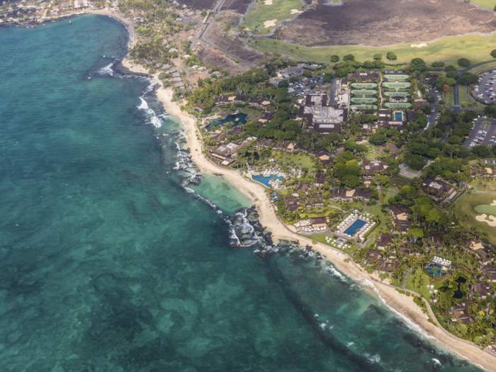 The resort includes a stretch of private beach and a golf course.