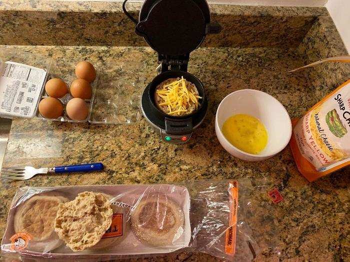 Once the light turns green, add the first layer of bread and cheese.