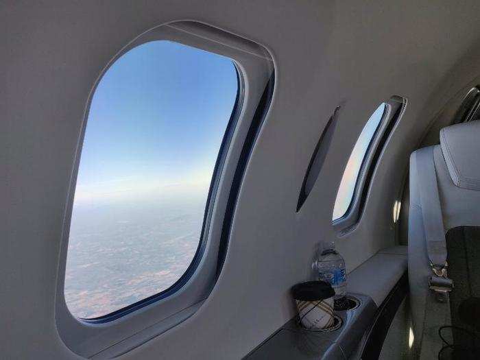 The view from the back of the plane is equally breathtaking. The large windows flood the cabin with natural light.