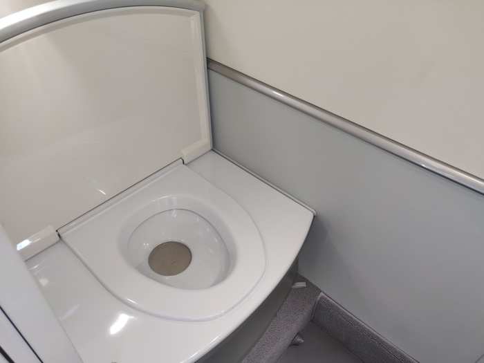 Under the seat, is a fully functional toilet.