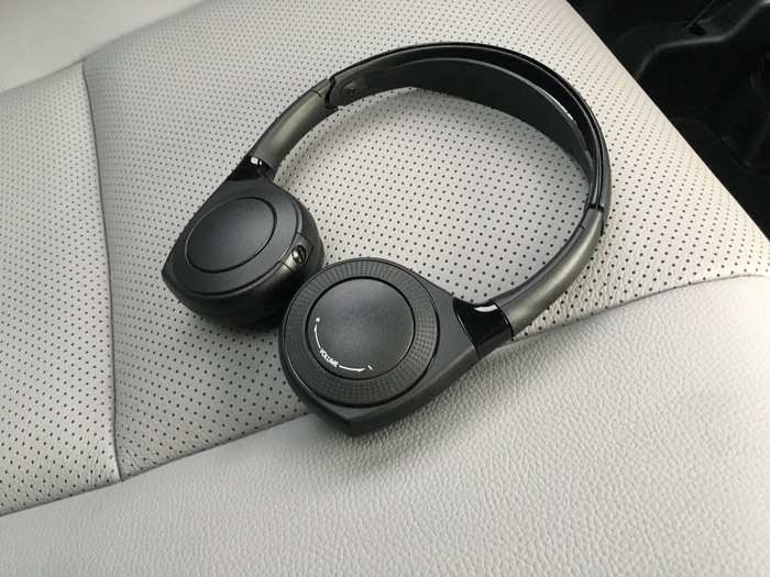 You can plug in wired headphones or you can use the pair of wireless units that come with the car.