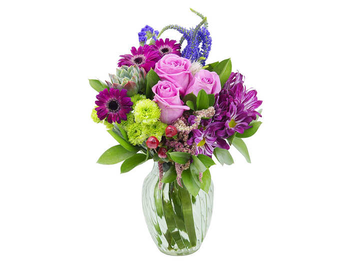 A mixed bouquet including roses, daisies, and more