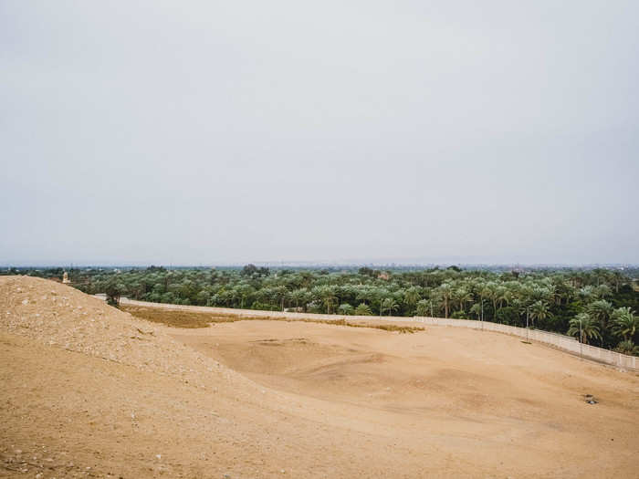 After exploring Saqqara, it was time for the grand finale — the Great Pyramid. But, first, I took a look at the view back towards Cairo. On a clear day, you can see the city in the distance. It was not a clear day.