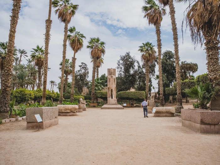 The centerpiece of the complex is a carved red granite statue of Ramses II. He is depicted in a powerful position with his muscles flexed and looking sternly on those below.