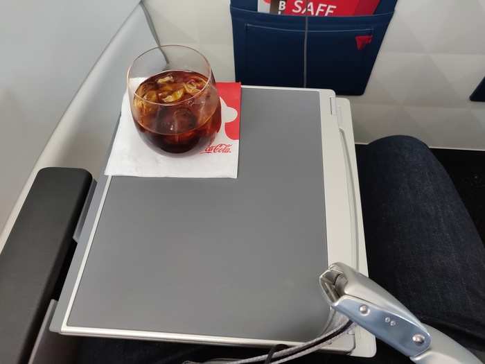 ... fold it in half for drinks. Speaking of drinks, Delta