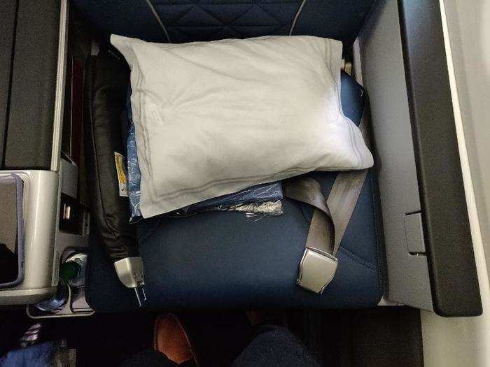 Waiting for me at my seat was a bottle of water, a pillow, and a blanket.