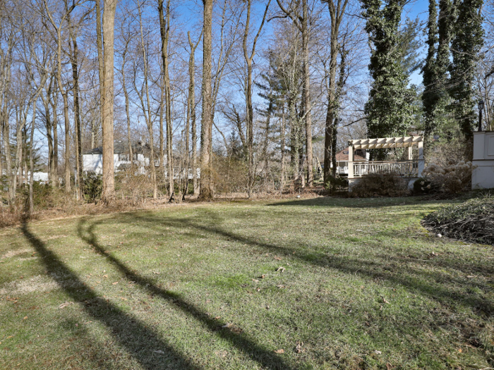 The house is situated on a private street, with only a few other homes nearby.