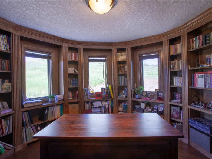 ... while the upstairs includes an office with shelf space for a personal library.