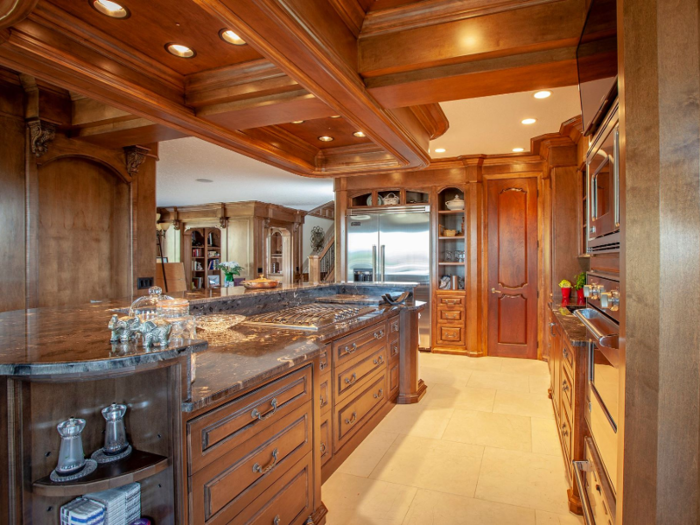 ... along with beautiful wooden cabinets and lots of granite counter space.