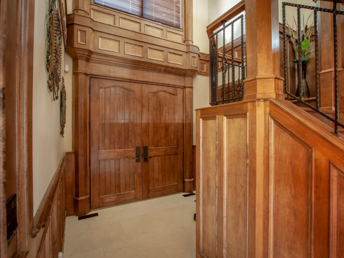 To enter the house, visitors first walk through a set of stately double doors ...