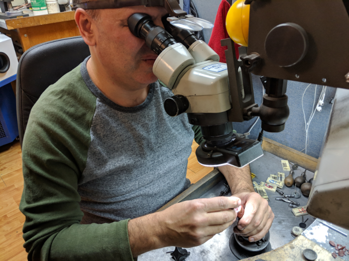 The jewelers were often looking through microscopes for the delicate work.