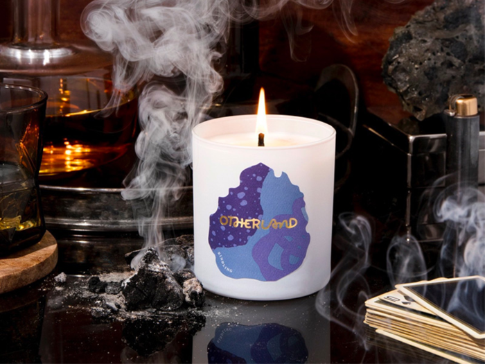 Kindling Candle from Otherland: 8 oz. and 55 hour burn time, with notes of wood, clove, and smoke