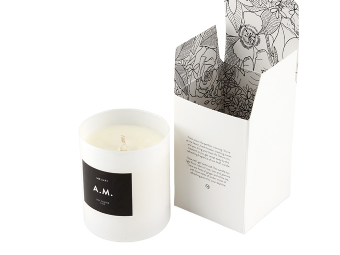 A.M. Candle from Mejuri: 9 oz. and 40-45 hour burn time, with notes of rose, lilac, and jasmine