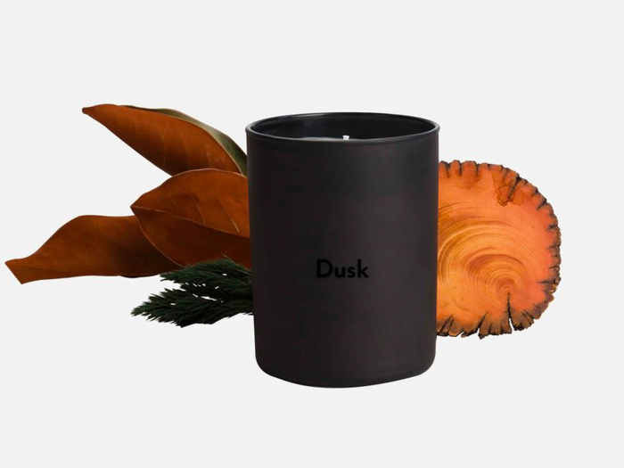 Dusk Candle from Brooklinen: 10.5 oz. and 50-60 hour burn time, smells like a "cozy cabin in the woods"