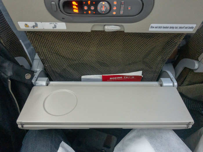 The tray table is foldable, so you have it open halfway for drinks ...