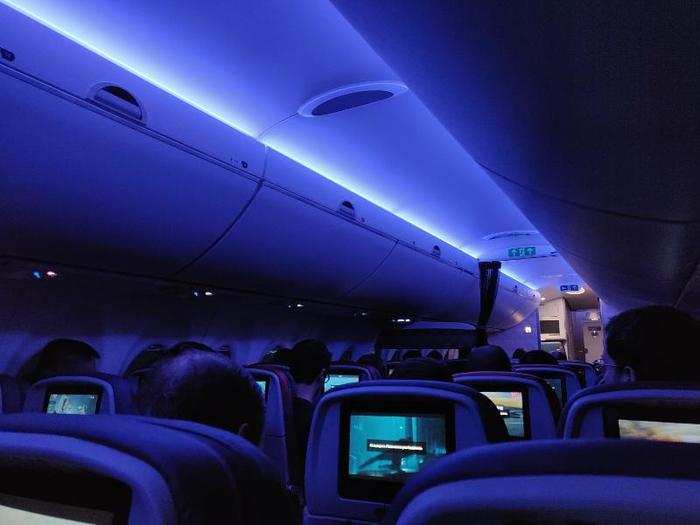 7. Mood lighting: The A220 cabin is bathed in rich blue mood lighting during flights. I