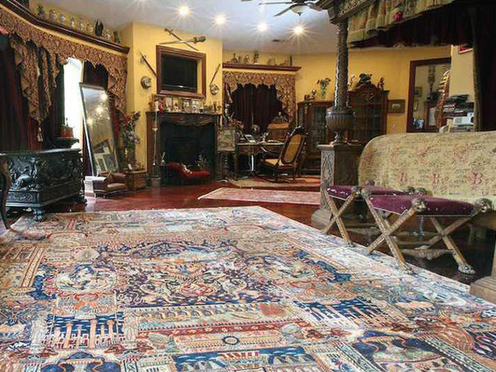 The gothic design flows throughout the house, even in the bedroom.