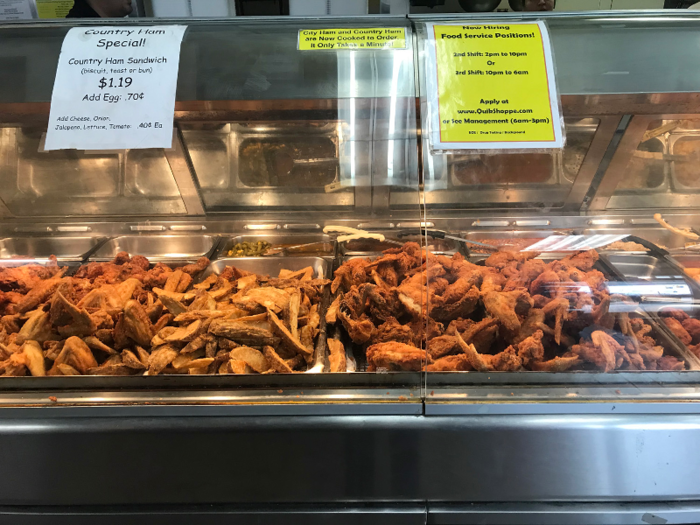 And inside, a smorgasbord of fried chicken, potato wedges, and more, scattered haphazardly.