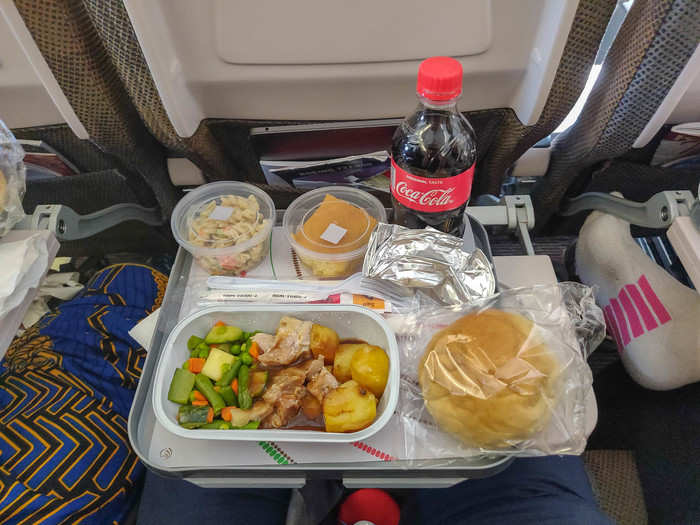 With my flight-time to Nairobi around five hours and twenty minutes, I was thankful that Kenya Airways had meal service. Dinner was chicken in a savory brown sauce with steamed veggies and potatoes.