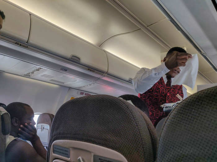 Once in the air, flight attendants came around to offer up a cool toilette to wipe your hands and face. It