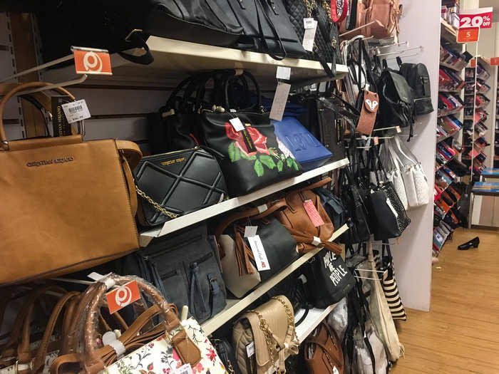 Handbags lined a wall close to the cash register.