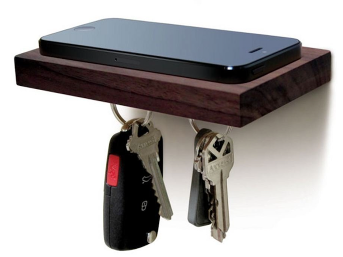 A floating wood shelf for stowing your phone and keys