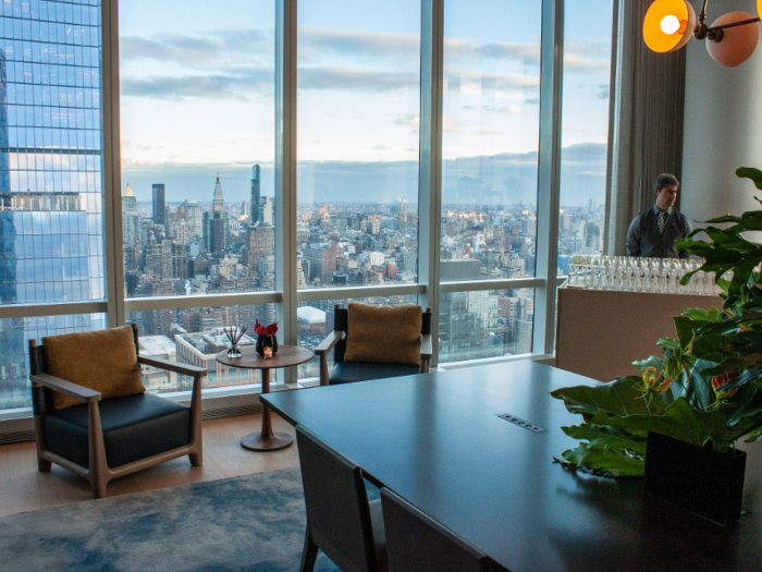 The co-working space featured a long conference table, comfortable chairs, and like the club room, floor-to-ceiling windows for optimal city views.