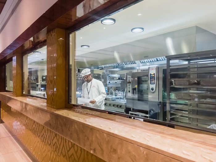 To get to the other food stations, I had to cross the concourse to the other side of the terminal, just to give you an idea of how big the lounge is. In the middle of the lounge, there are some open windows so you can watch the chefs work.