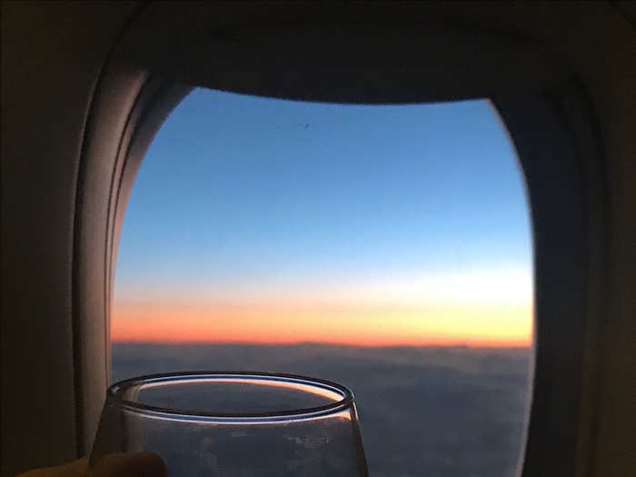 I finished my glass of wine (the portions were huge) while looking out at the stunning sunset over the clouds, since I had a window seat, instead of one in the centre of the cabin.