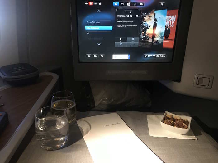 Before dinner was about to be served — which was much earlier in the flight than it was for economy passengers — a flight attendant set my tray table with a table cloth, napkin, and some nuts.