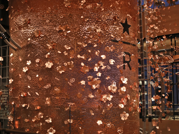 The cask spans all four floors and is decorated with copper cherry blossoms.