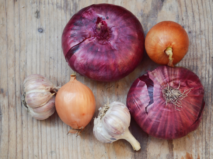 Allium vegetables like onions, shallots, leeks, and garlic do more than give us bad breath: People who eat lots of them reduce their risk of cancers of the gut.