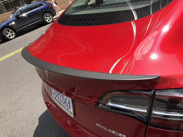 A short lip of carbon-fiber makes up the truck-lid spoiler and is a clue that this Model 3 has a bit more under the hood.