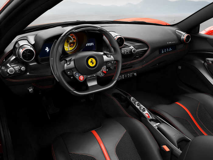 "The cabin retains the classic, driver-oriented cockpit look typical of Ferrari’s mid-rear- engined berlinettas, but every element of the dash, door panels and tunnel, has been completely redesigned," Ferrari said in a statement.