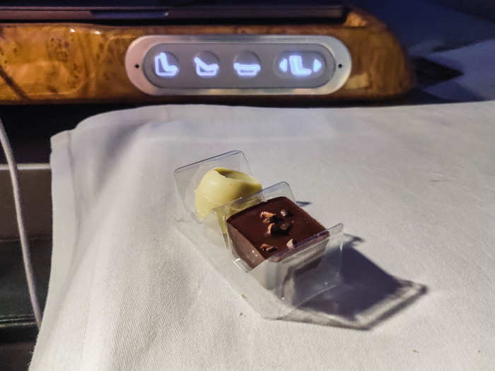 As if reading my mind, the flight attendant brought over a two-pack of chocolates which consisted of a dark sea salt square and a white chocolate truffle.