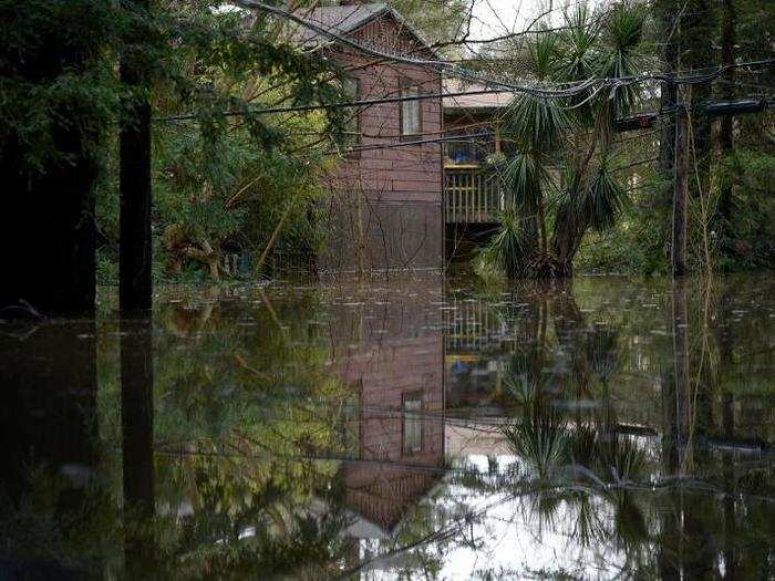 Those people who chose to wait out the flood in their homes could be stuck for days, the Los Angeles Times reported.