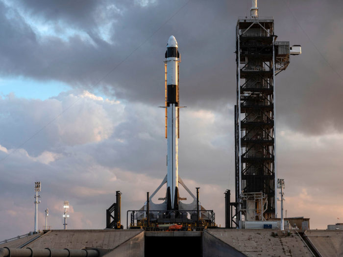 On the launch pad, SpaceX briefly test-fired the Falcon 9 rocket