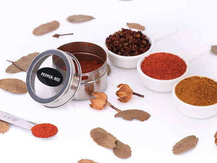 A set of magnetic tins that keep my spices organized and at an arm